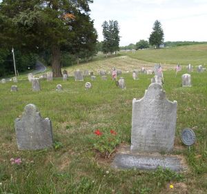 Ill. 3b Christina Mertz's tombstone with acid rain damage and Johann Jacob Mertz's replaced gravemarker d