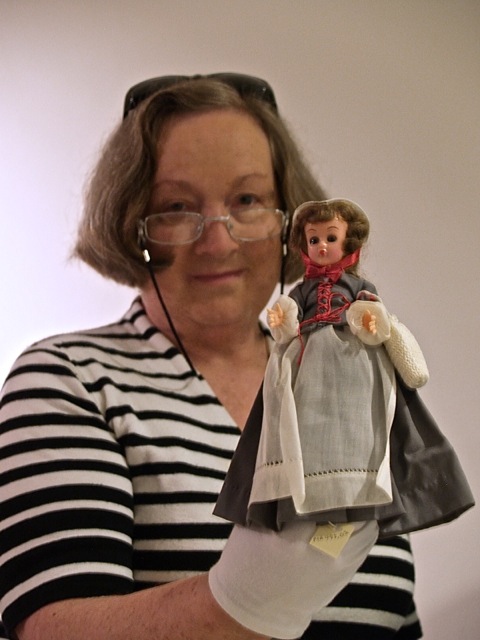 ILL. 9. Curator Mary Brown with Becky Langley Doll. Moravian Museum of Bethlehem. Courtesy AlyssumArts